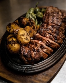 beef with roast potatoes and green vegetables