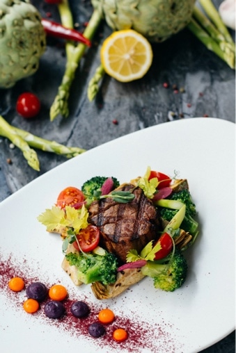 Steak on a bed of vegetables