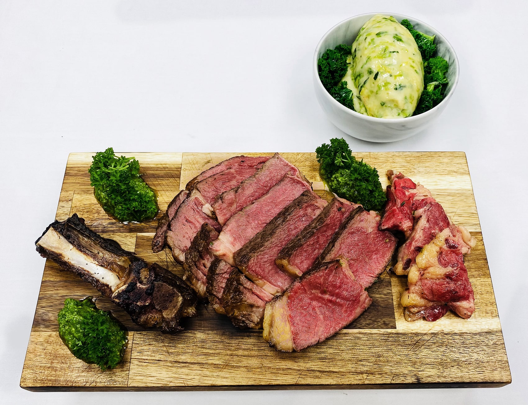 Carved up beef on chopping board