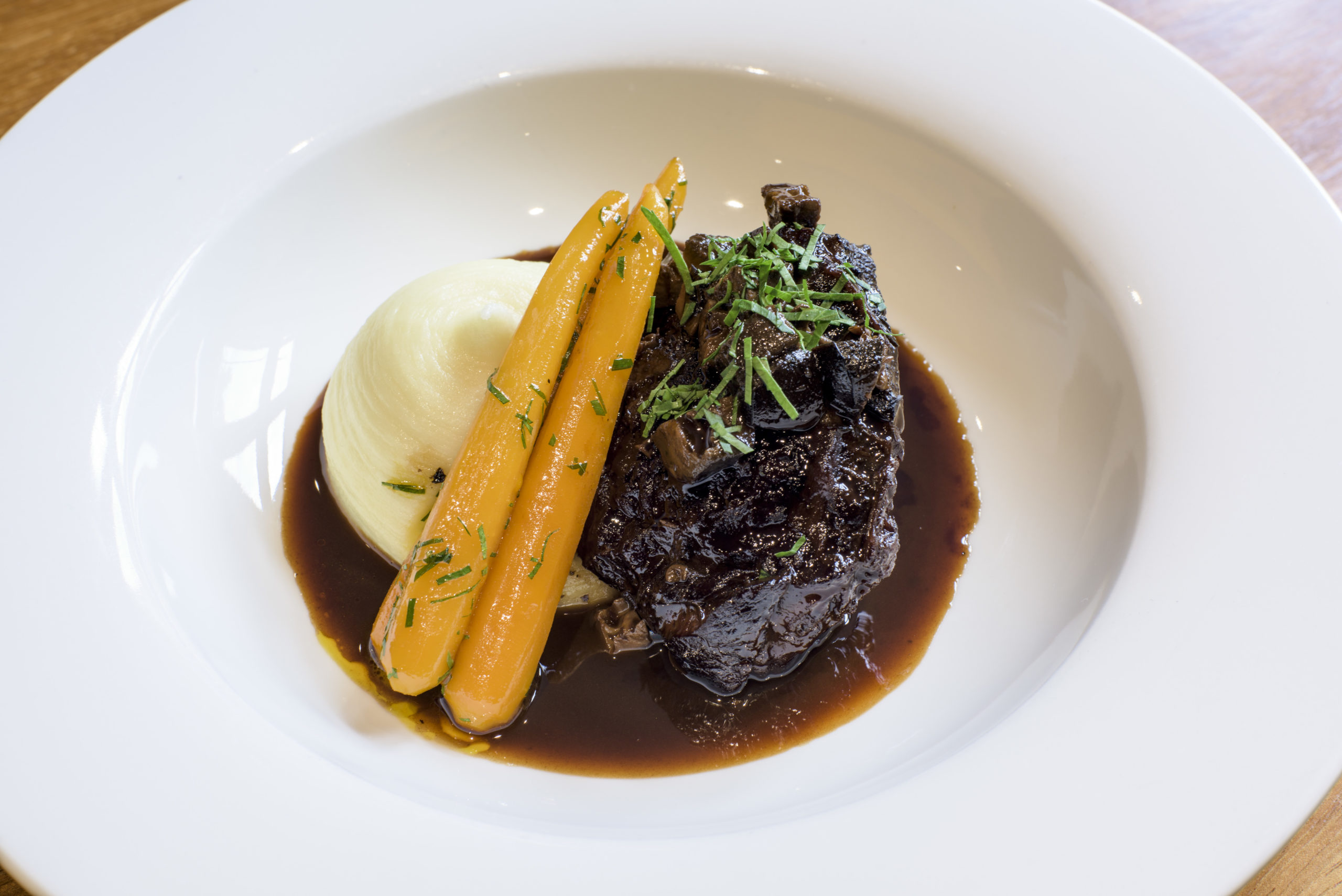 Braised Irish beef cheek, pickled walnuts, smoked anchovy, glazed carrots and mash