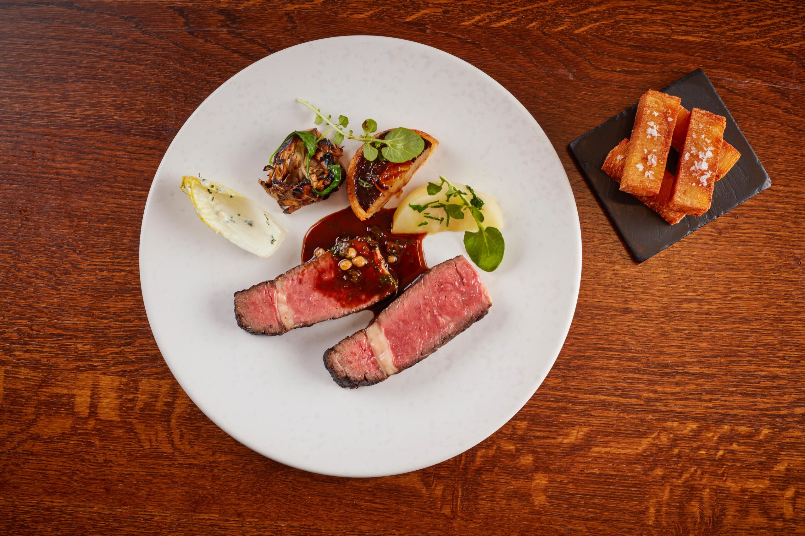 Charcoal grilled grass fed Irish rib eye with a stout and pickled walnut Bordelaise sauce