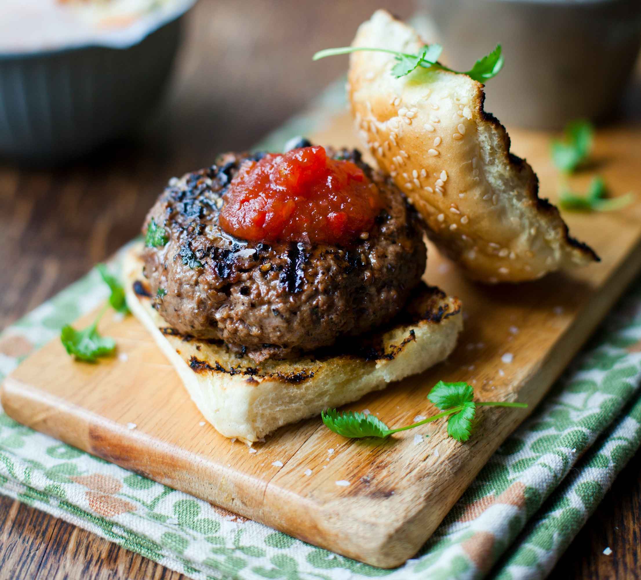 Peppercorn studded burger, tricolour slaw & sweet potato wedges