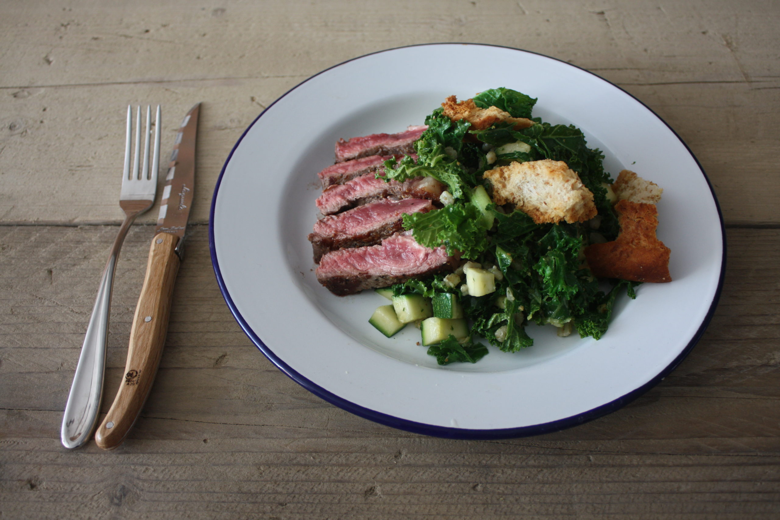 Warm summer salad with sirloin steak and shamrock greens