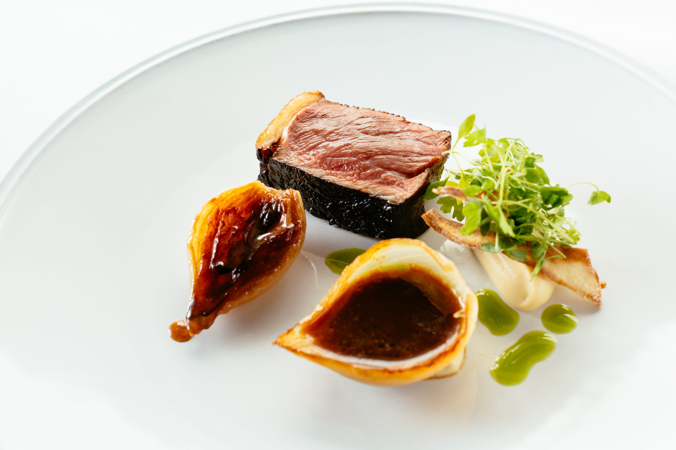 Blackened Sirloin Steak with Salted Caramel Onions and Parsley Salad