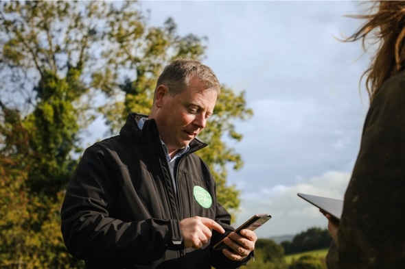 auditor making checks on farm