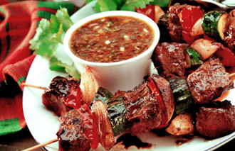 Steak skewers with a tomato & tarragon dressing