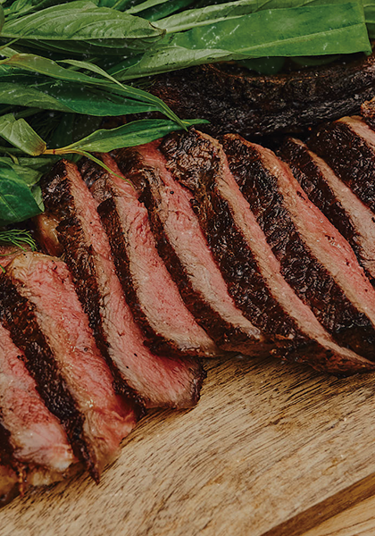 Slices of beef on a wooden board