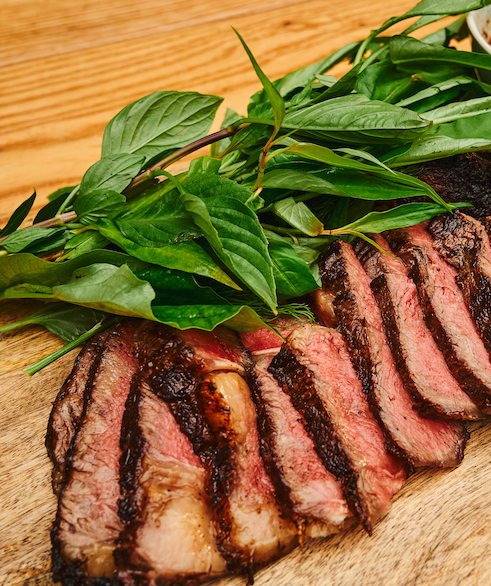 Slices of beef on a wooden board