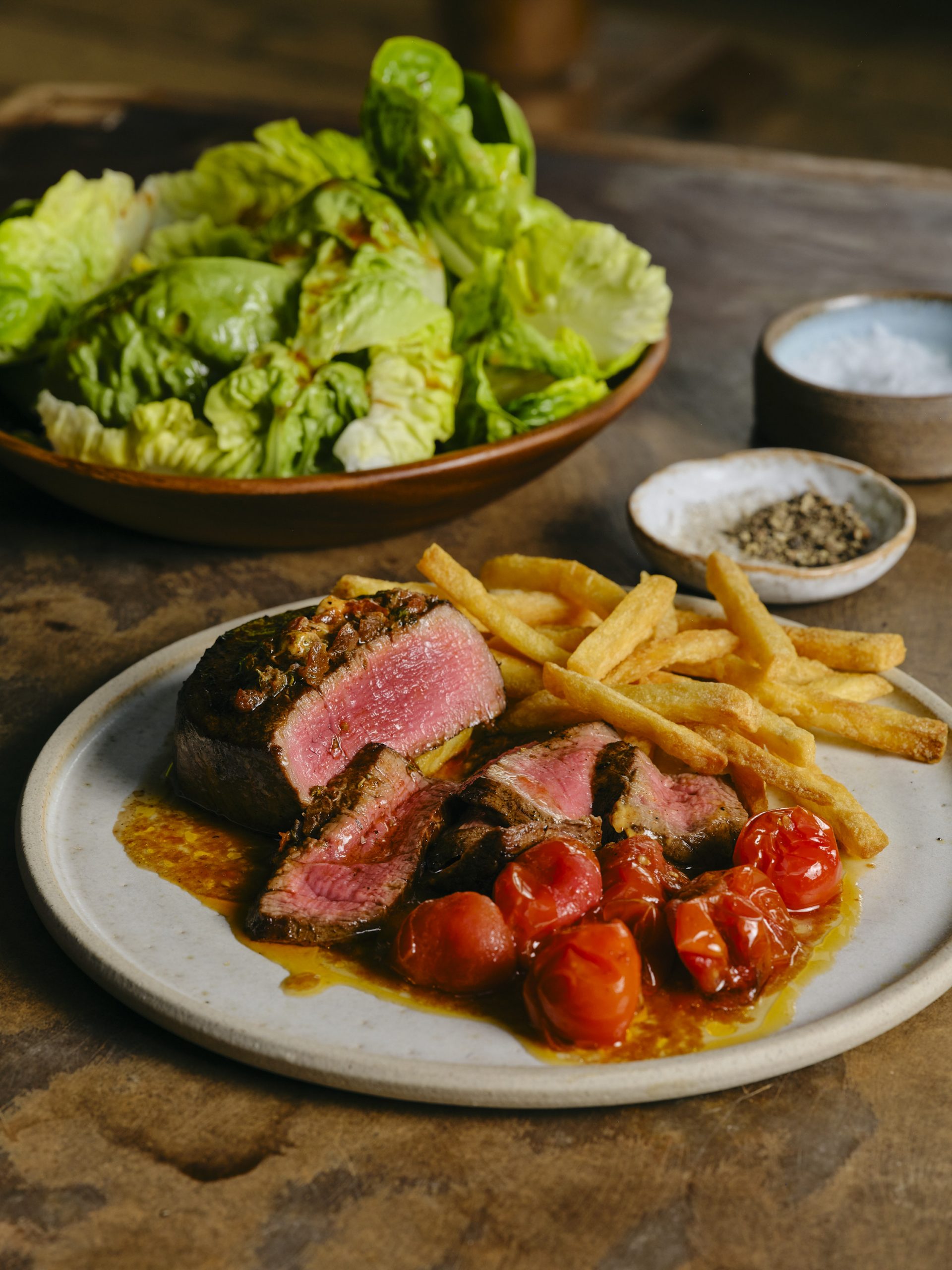 Tomatoes, rare steak and chips